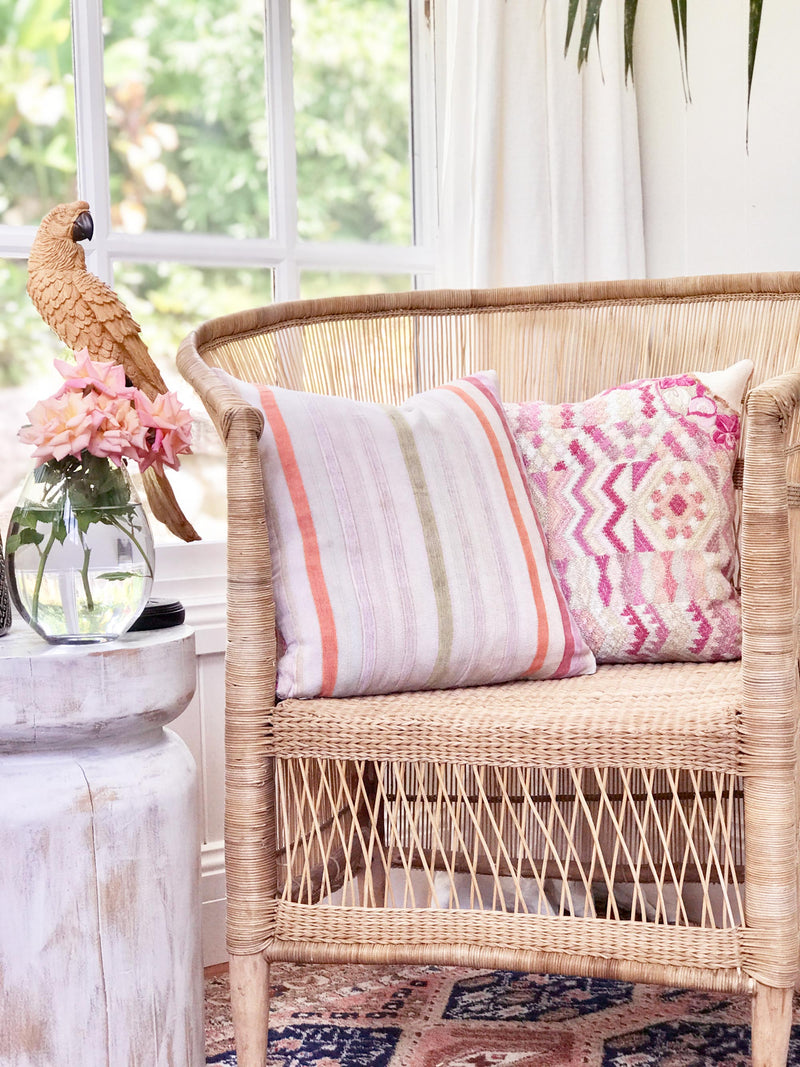 Vintage textile cushion made from a Guatemalan huipil and corte
