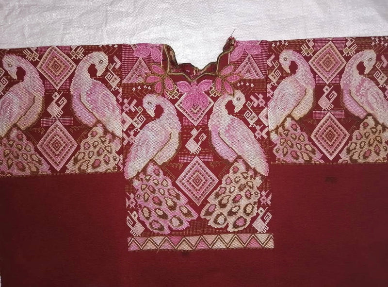 Guatemalan huipil pillow. A vintage textile with a red peacock bird design.