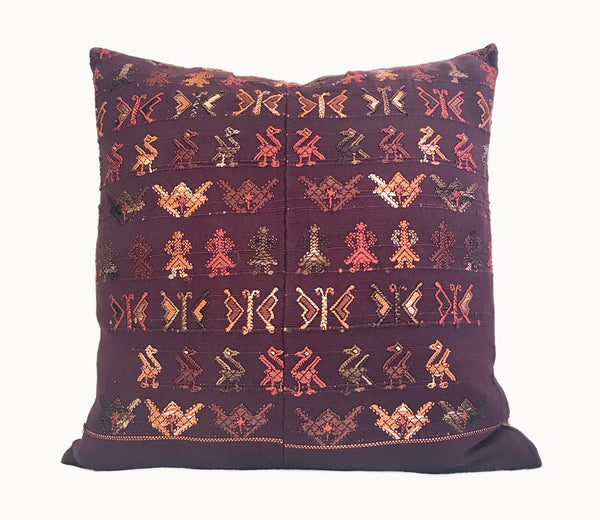 Brown Guatemalan embroidered huipil pillow. 