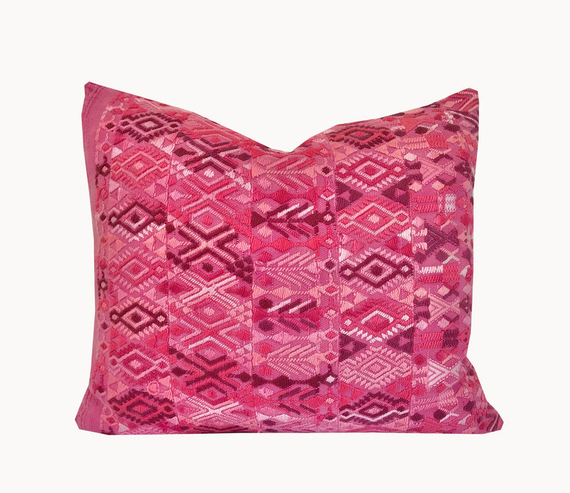 A pair of Guatemalan Huipil Pillows, vintage, hand embroidered textiles in bright pink with a playful tribal design