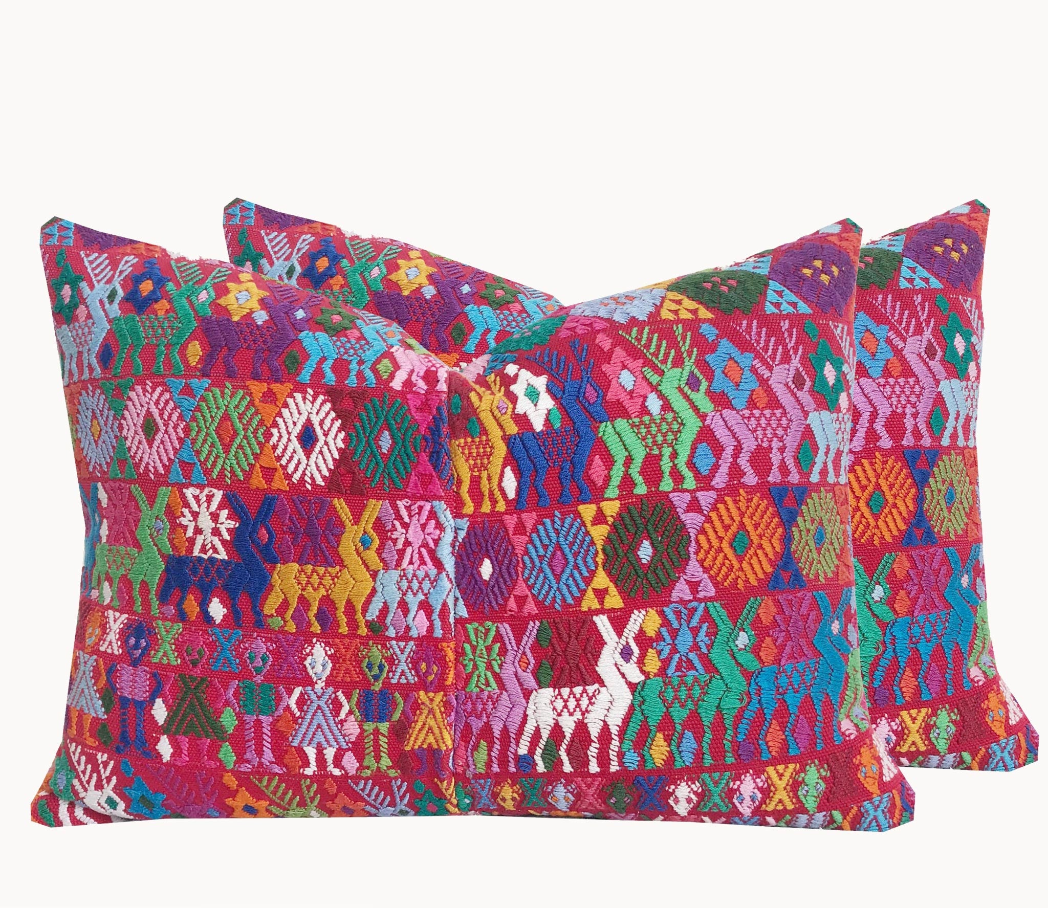 Guatemalan Huipil Pillow, vintage, hand embroidered Coban textile of brightly coloured tribal figures over a red cotton